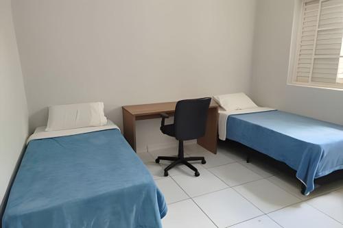 Una cama o camas en una habitación de Unidade 2