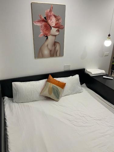 Ένα ή περισσότερα κρεβάτια σε δωμάτιο στο Homestay Huế Ơi