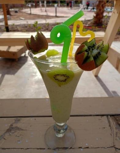 a drink with a straw in a glass with a number two at Elegant Apartments & Aquapark - B&B- FREE WI-FI-Sharm El Sheikh in Sharm El Sheikh