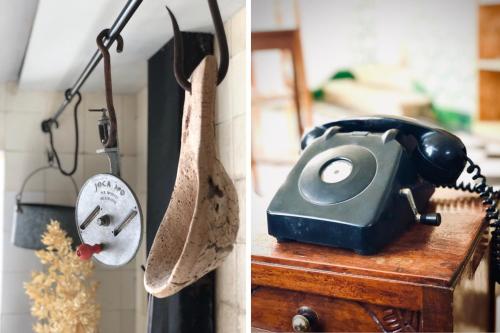 a telephone sitting on top of a wooden table at Train Spot Guesthouse in Marvão