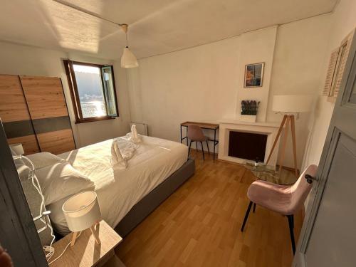 Ένα ή περισσότερα κρεβάτια σε δωμάτιο στο Casa Borromini - Parking - Vista Lago di Lugano