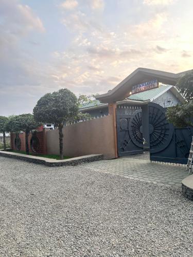 a building with a gate in front of it at Le Parlour in Boma la Ngombe