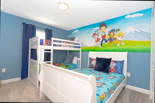 a bedroom with two bunk beds with sonic the hedgehog mural at Gorgeous 4 Bd w/ Pool at Champions Gate Resort 1020 in Orlando