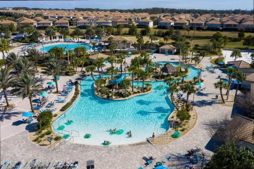 an aerial view of a pool at a resort at Gorgeous 4 Bd w/ Pool at Champions Gate Resort 1020 in Orlando