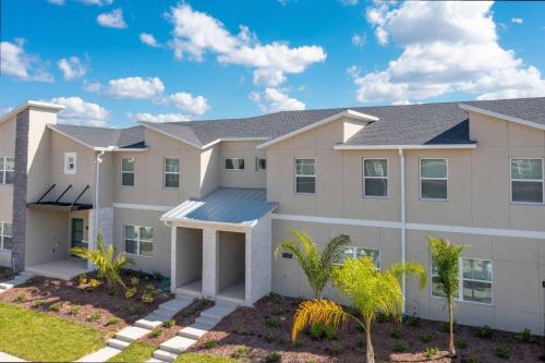 an image of a large apartment building at Gorgeous 4 Bd w/ Pool at Champions Gate Resort 1020 in Orlando