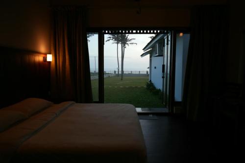 Ένα ή περισσότερα κρεβάτια σε δωμάτιο στο Ayada Cliff Beach Villas
