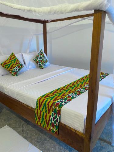 two bunk beds with pillows on top at Karibu House Paje in Paje