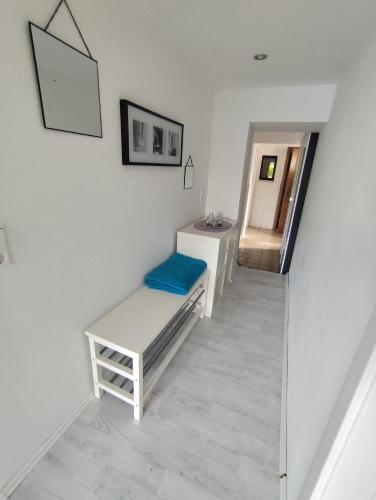 a white bathroom with a sink and a mirror at Ferienwohnung mit großem Garten in Jesewitz