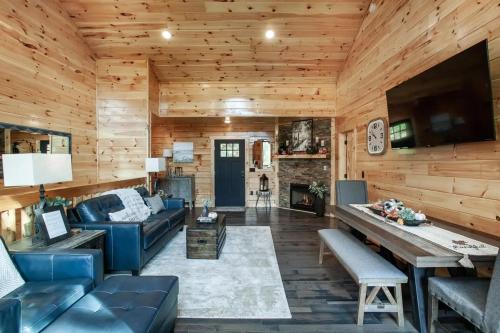 a living room with a couch and a fireplace at Relaxing With a View by American Patriot Getaways in Glade