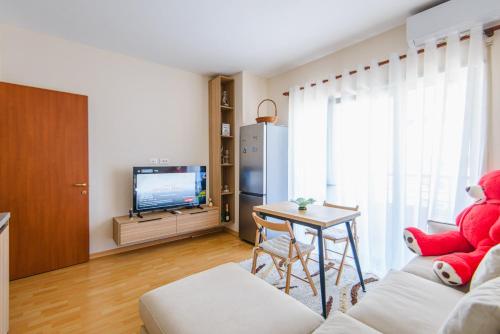 TV a/nebo společenská místnost v ubytování Ego Apartment