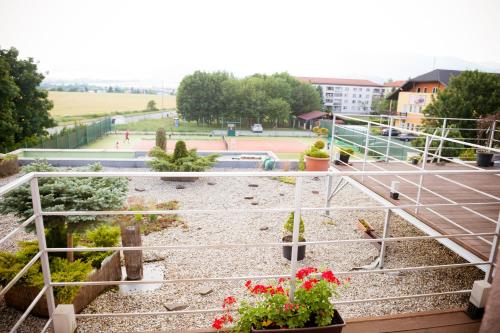 a view of a garden from a balcony at Penzión Ľadoveň SKVELÁ KUCHYŇA A RODINNÁ ATMOSFÉRA in Martin