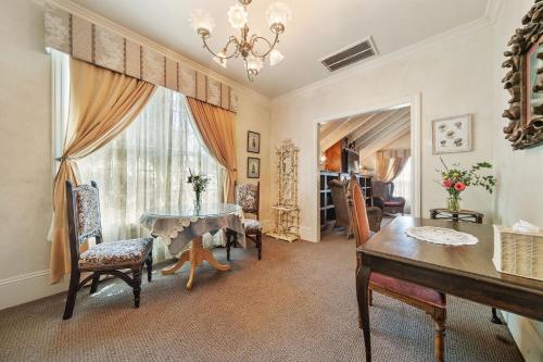 a dining room with a table and a window at Brinnwood Bed & Breakfast in Sutter Creek