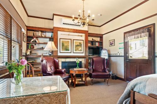 a living room with a table and two chairs at Brinnwood Bed & Breakfast in Sutter Creek