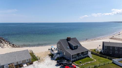 an aerial view of a house and the beach at Oceanfront Cape Cod House by Rock Properties in Sandwich