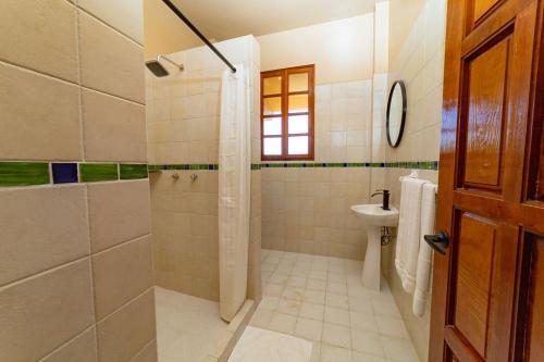 a bathroom with a shower and a toilet at Casa Ceiba Huatulco - Adults Only in Santa Cruz Huatulco