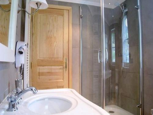 a bathroom with a sink and a shower at Spacious Place in Hamoir in Hamoir