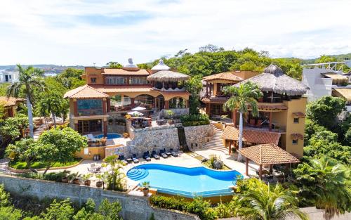 an aerial view of a house with a swimming pool at Casa Ceiba Huatulco - Adults Only in Santa Cruz Huatulco