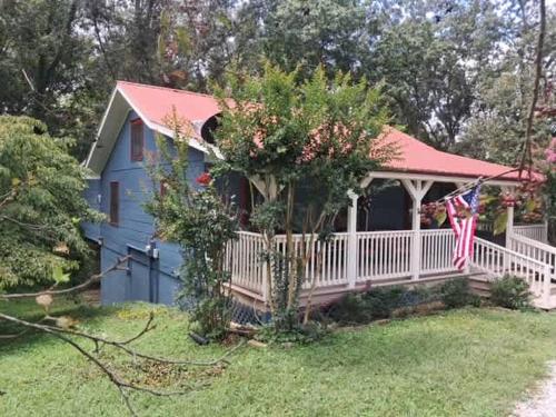 a blue house with a red roof at Pigeon Ridge Cabin Cumberland State Park 2B 2B in Crossville