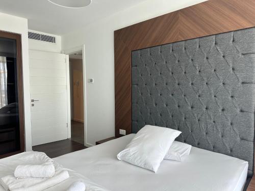 a bedroom with a large white bed with two pillows at Grand Sapphire Luxury Residence By MyGuest Cyprus in Iskele
