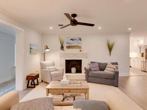 a living room with a couch and a fireplace at Dragonfly Cove in Mount Pleasant