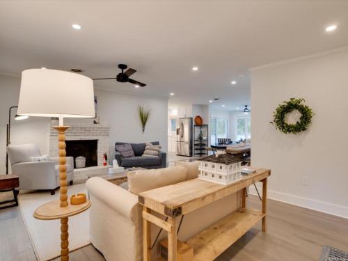 a living room with a couch and a table at Dragonfly Cove in Mount Pleasant
