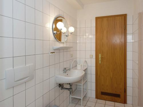 a bathroom with a sink and a mirror at Majestic Stay in Deutschneudorf in Deutschneudorf