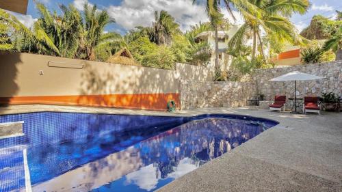 Πισίνα στο ή κοντά στο Las Olas Litibu Apartment