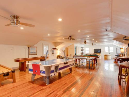 a large room with several ping pong tables in it at Captains Cove in Saint Michaels