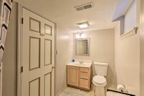 a bathroom with a toilet and a sink at Cozy Stay 2min to DT Cincinnati & UC Medical Center in Cincinnati