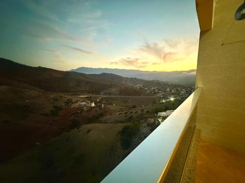 a view of a valley from a window of a building at Apartamentos Al Borj 3J إقامة البرج in Ifargane