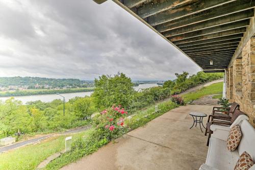 a porch with benches and a view of a river at Cozy Stay 2min to DT Cincinnati & UC Medical Center in Cincinnati