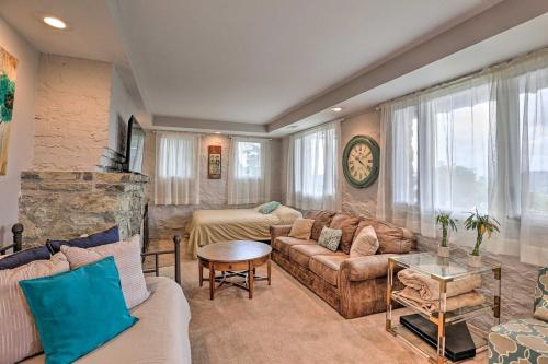 a living room with a couch and a table at Cozy Stay 2min to DT Cincinnati & UC Medical Center in Cincinnati