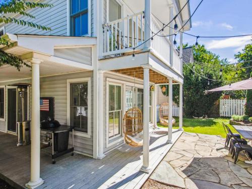 a house with a deck with a patio at Eventide of Oxford in Oxford