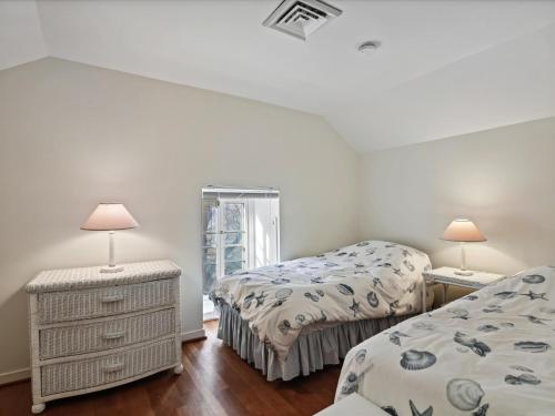 a bedroom with two beds and two lamps in it at Fairview Estate in Saint Michaels