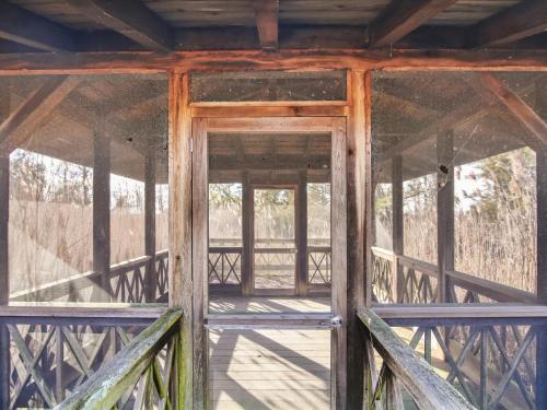 an open door of an old wooden building at Fairview Estate in Saint Michaels
