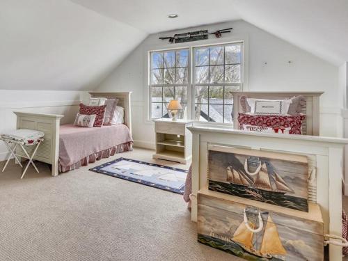 a bedroom with a bed and a window at Ferry View in Oxford