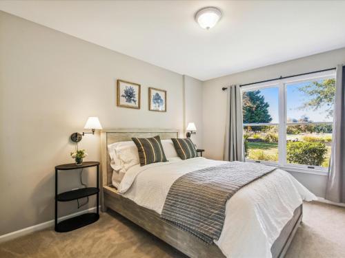a bedroom with a large bed and a window at Lighthouse Haven in Paradise Island