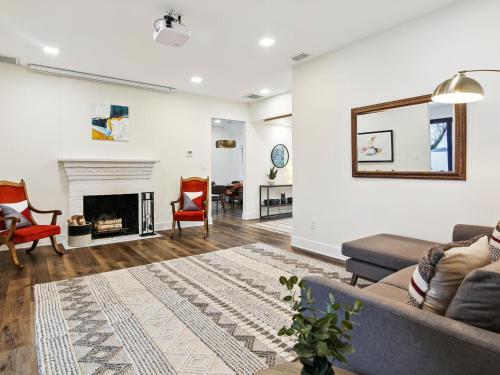 a living room with a couch and a fireplace at Mill Point in Neavitt