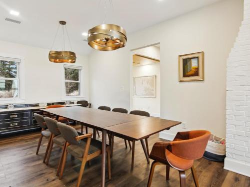 a dining room with a wooden table and chairs at Mill Point in Neavitt