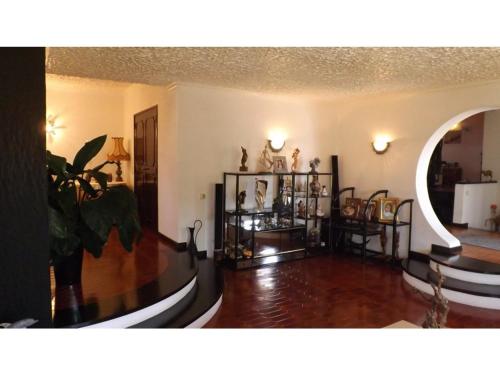 a living room filled with lots of items on display at Casa Teresinha in Sesimbra