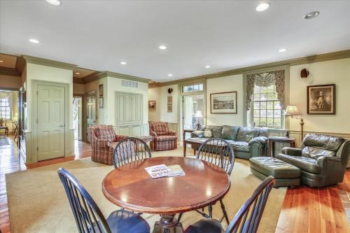 a living room with a table and chairs at Thornton in Kennedyville