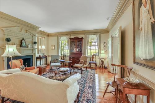 a living room with a couch and a fireplace at Thornton in Kennedyville