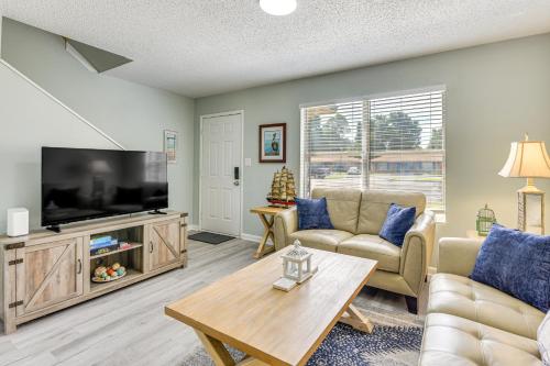 a living room with a couch and a tv at 2 Mi to State Park Dog-Friendly Niceville Home in Niceville