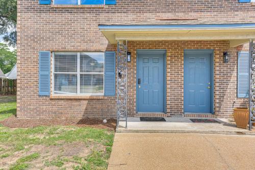 a brick house with two blue doors on it at 2 Mi to State Park Dog-Friendly Niceville Home in Niceville