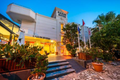 a building with potted plants in front of it at Kalkan Suite 103 in Kalkan
