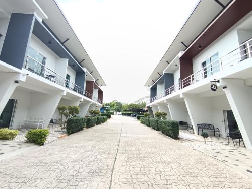 an empty courtyard of an apartment building at Makan Resort in Kanchanaburi