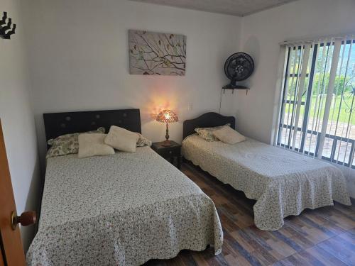 Ένα ή περισσότερα κρεβάτια σε δωμάτιο στο Finca Hotel Villa Claudia, La Mesa Cundinamarca