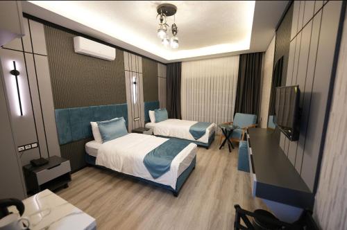 Ένα ή περισσότερα κρεβάτια σε δωμάτιο στο Milena Otel