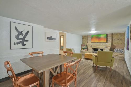 a living room with a wooden table and chairs at Communal Crashpad-City Card for local biz discounts in Oklahoma City