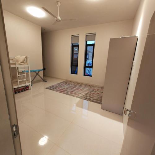 a room with a door open to a room with a rug at لآلي شاليه Laali Chalet in Birkat al Mawz